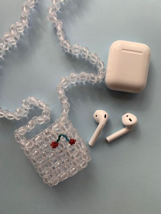 crystal airpods case with cherry shaped design in it